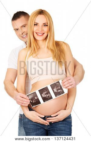 Couple holding usg scan of their baby