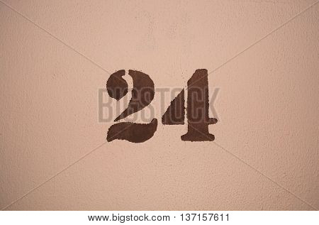 The number twenty four painted on the wall