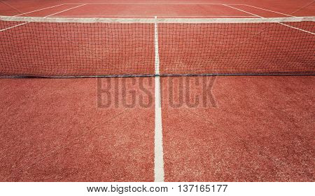 Outdoor red painted grass tennis court background