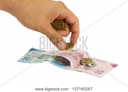 Hand counting money bills and coins on white background
