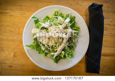 Fresh organic caesar salad with grated asiago cheese