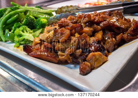 Chinese food buffet self service Teriyaki chicken with broccoli