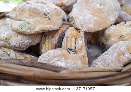 Closeup pile of fresh Irish tea scones arranged in basket