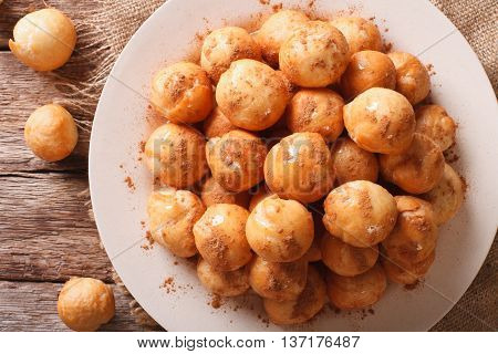 Greek Loukoumades Donuts With Honey And Cinnamon Closeup. Horizontal  Top View