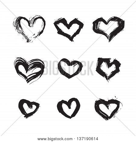 Hand drawn ink heart symbol set. Abstract vector black textured brush heart shape isolated on white background.