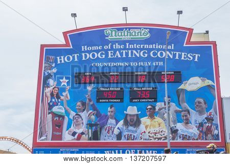 NEW YORK, JULY 4, 2016 - Nathan's hot dog eating contest countdown clock and 100th birthday of Nathan's Famous restaurant at the corner of Surf and Stillwell avenues, Coney Island