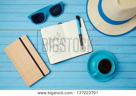 Summer holiday background with notebook for sketching and coffee cup. Vacation planning concept. Top view