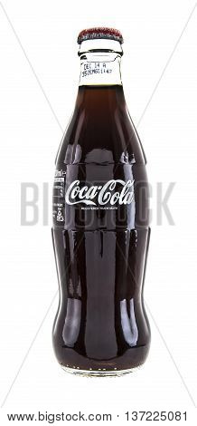 SWINDON UK - JANUARY 1 2014: Cassic Coca-Cola Bottle on White Background The Coca-Cola Company is an American multinational beverage corporation and manufacturer