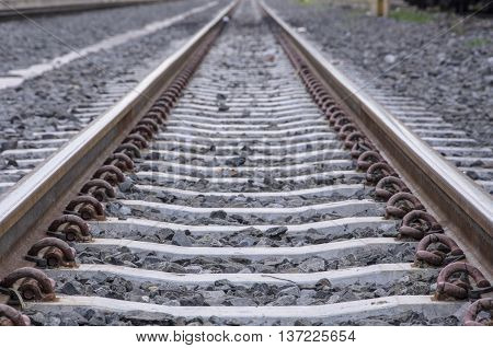 A switch leading the way photographed with a very shallow depth of field in the evening.