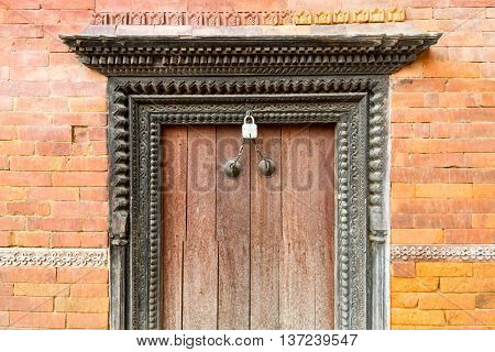 Old and artistic wooden door of Nepal with the unique vintage look.