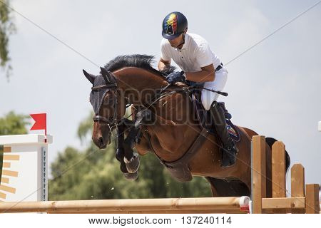 Turda, Cluj, Romania - June 19, 2016: An unidentified competitor jumps with his horse at the Salina Equines Horse Trophy , June 19, 2016 in Turda, Romania