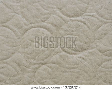 Recycled corrugated cardboard paper texture background with debossed circle shape