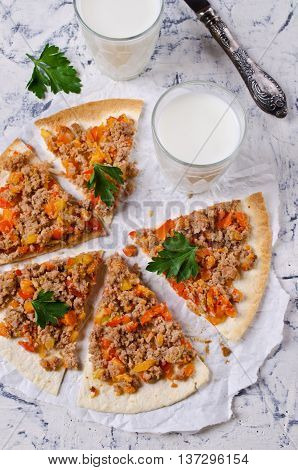 Traditional Asian thin tortilla with minced meat and vegetables. Selective focus.
