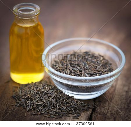 Caraway seeds with essential oil in glass bowl