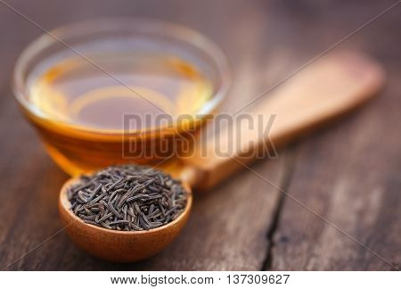 Caraway seeds with essential oil in glass bowl