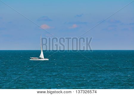 White Yacht Goes to the Port in the Black Sea