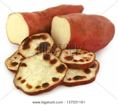 Close up of Baked sweet paotatoes over white background