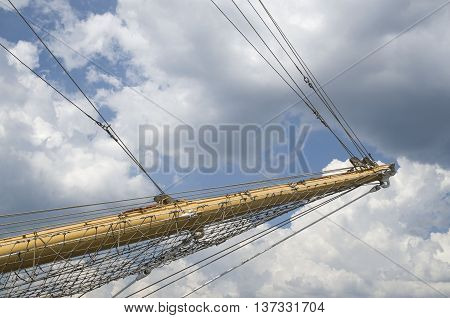 Front mast of sailboat in harbor in cloudy day Europe