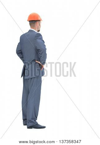 Engeneer  from the back - looking at something over a white background