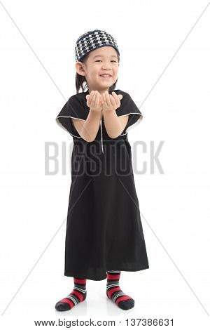 Cute muslim chlid on white background isolated.