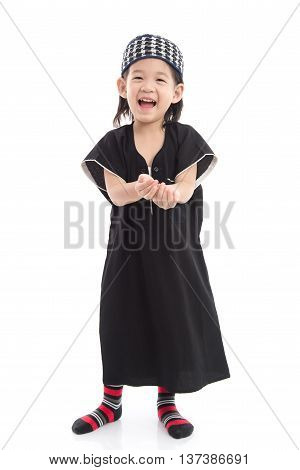 Cute muslim chlid on white background isolated.