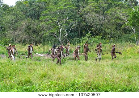 Warriors Of A Papuan Tribe In Traditional Clothes