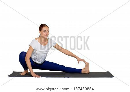 sports exercise isolated on white background. Positive woman dressed in sportswear doing stretching legs.