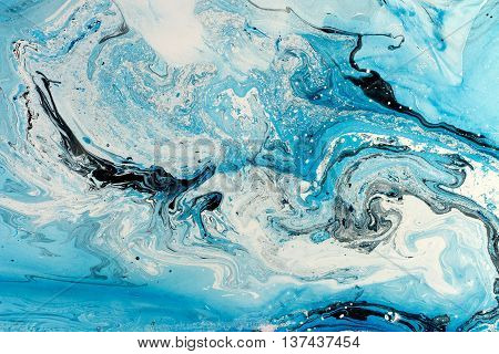 Blue marbling texture. Creative background with abstract oil painted waves handmade surface. Liquid paint.