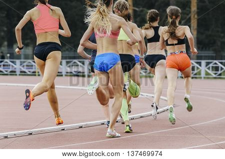 race of women athletes in stadium during athletics competitions