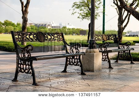 Stylish bench in city park under sunny light Sanam Luang Bangkok Thailand
