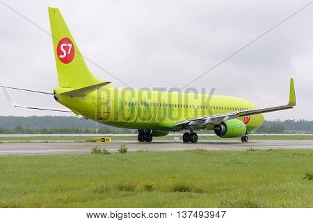 MOSCOW, RUSSIA - MAY 19, 2016: Aircraft Boeing737 S7 Airlines taxiing. Plane makes taxiing on taxiway Domodedovo International Airport.