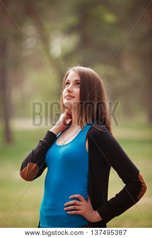 Beautiful brunette Girl in a park in sunny day