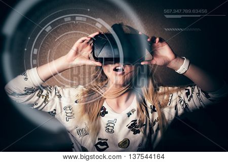 blonde girl playing and enjoy in virtual reality