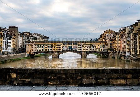 Perspective view of Old Ponte Vecchio Bridge on dull day, Florence, Tuscany region, Italy