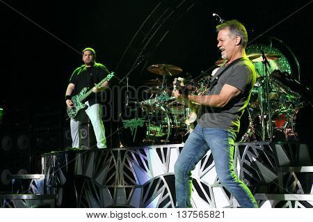 WANTAGH, NY-AUG 14: Eddie Van Halen (R) and son Wolfgang Van Halen of Van Halen perform onstage at Jones Beach Theater on August 14, 2015 in Wantagh, New York.