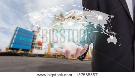 Global network coverage world map on hand of businessman. Industrial Container Cargo freight ship at habor for Logistic Import Export background (Elements of this image furnished by NASA)