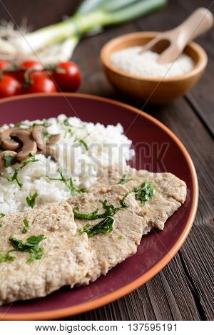 Pork loin fillets with rice and mushrooms