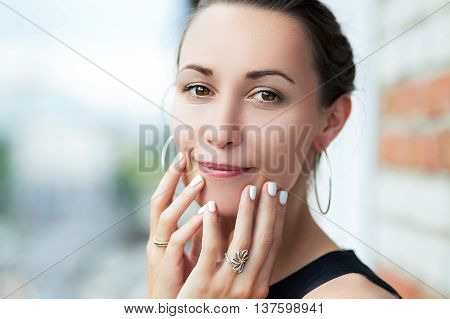 Closeup portrait of a girl, youth and beauty, soft and velvet skin. Make-up on her face
