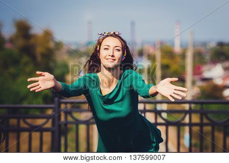 Smiling girl with hugs and greetings joyful and fun
