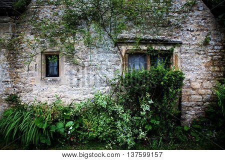 Traditional Cotswold cottages in England, UK. Bibury is a village and civil parish in Gloucestershire, England.