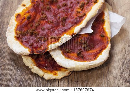 mix of Lahmacun a turkish pizza on wood