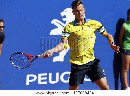 BARCELONA - APRIL,19: Hungarian tennis player Marton Fucsovics in action during a match of Barcelona tennis tournament Conde de Godo on April 19, 2016 in Barcelona