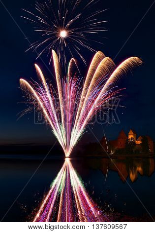 Fireworks in Trakai, Lithuania. Trakai Castle at night - Island castle in Trakai is a museum and a cultural center, Lithuania. Fireworks in Lithuania
