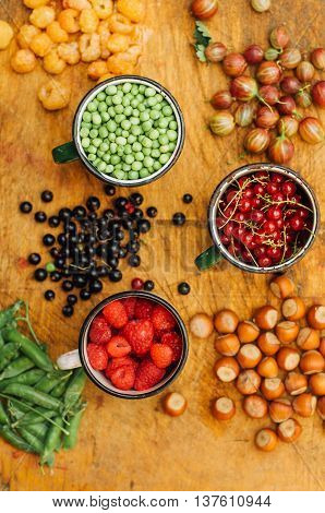 Colorful Mix Of Fruits On Black Background. View From Above. Fresh Organic Berries ,  So You Can Eat