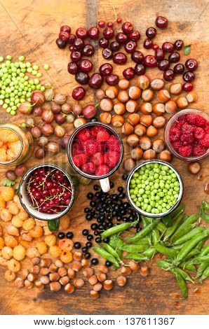 Colorful Mix Of Fruits On Black Background. View From Above. Fresh Organic Berries ,  So You Can Eat
