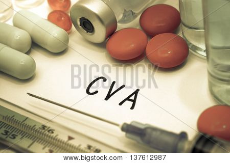 CVA - diagnosis written on a white piece of paper. Syringe and vaccine with drugs.