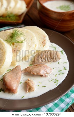 Turkey meat with dill sauce and bread dumpling