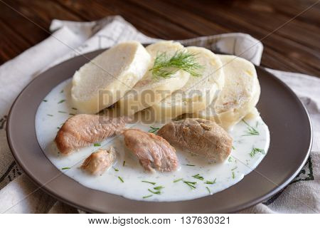 Turkey meat with dill sauce and bread dumpling