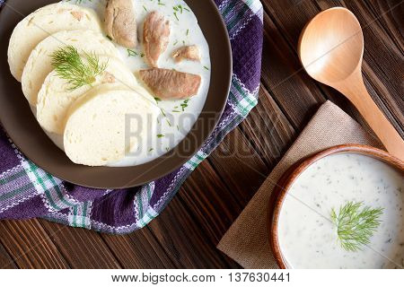 Turkey meat with dill sauce and bread dumpling