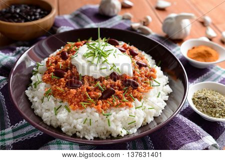 Mexican food Chili con carne on a wooden background